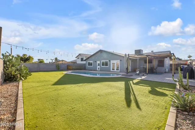 a view of a swimming pool with a chairs