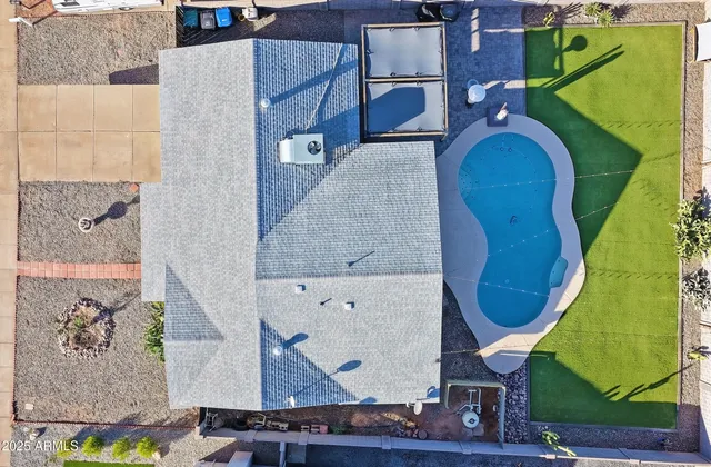 an aerial view of a highlighted house