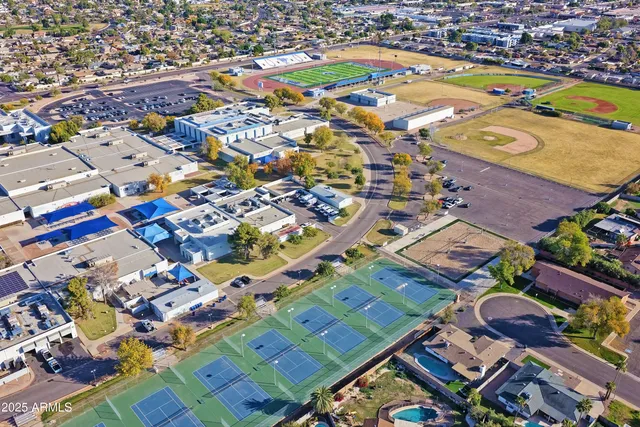 an aerial view of residential houses with outdoor space
