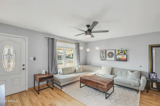 a living room with furniture and a window