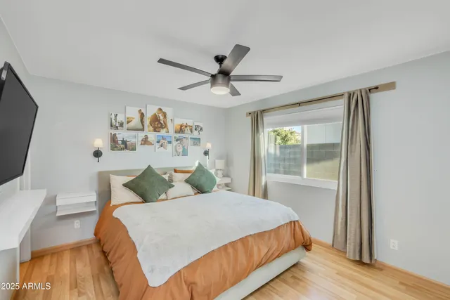 a bedroom with a bed and a window