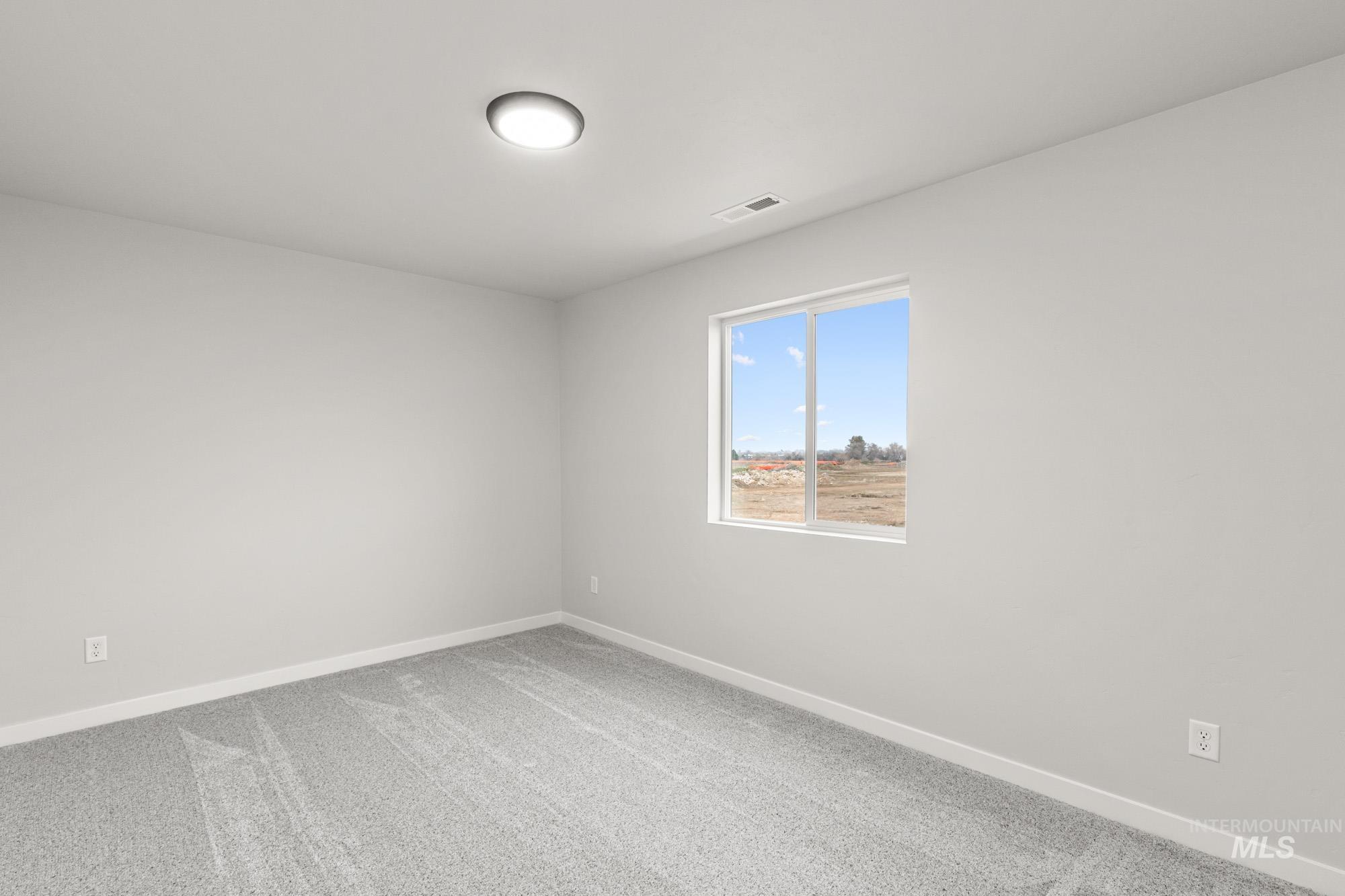 4287 South Red Sox Way Nampa, ID 83686 - Photo 12 of 22 Carpeted empty room with baseboards