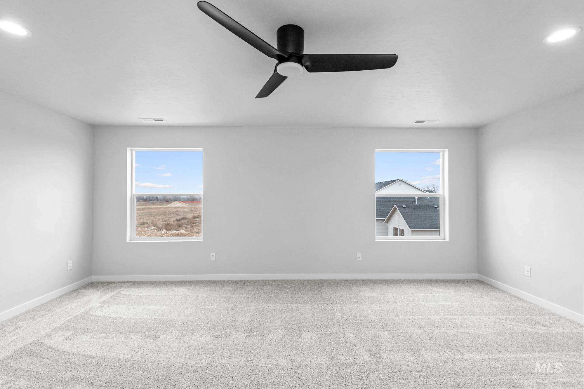 4287 South Red Sox Way Nampa, ID 83686 - Photo 14 of 22 Spare room with recessed lighting, light carpet, plenty of natural light, and a ceiling fan