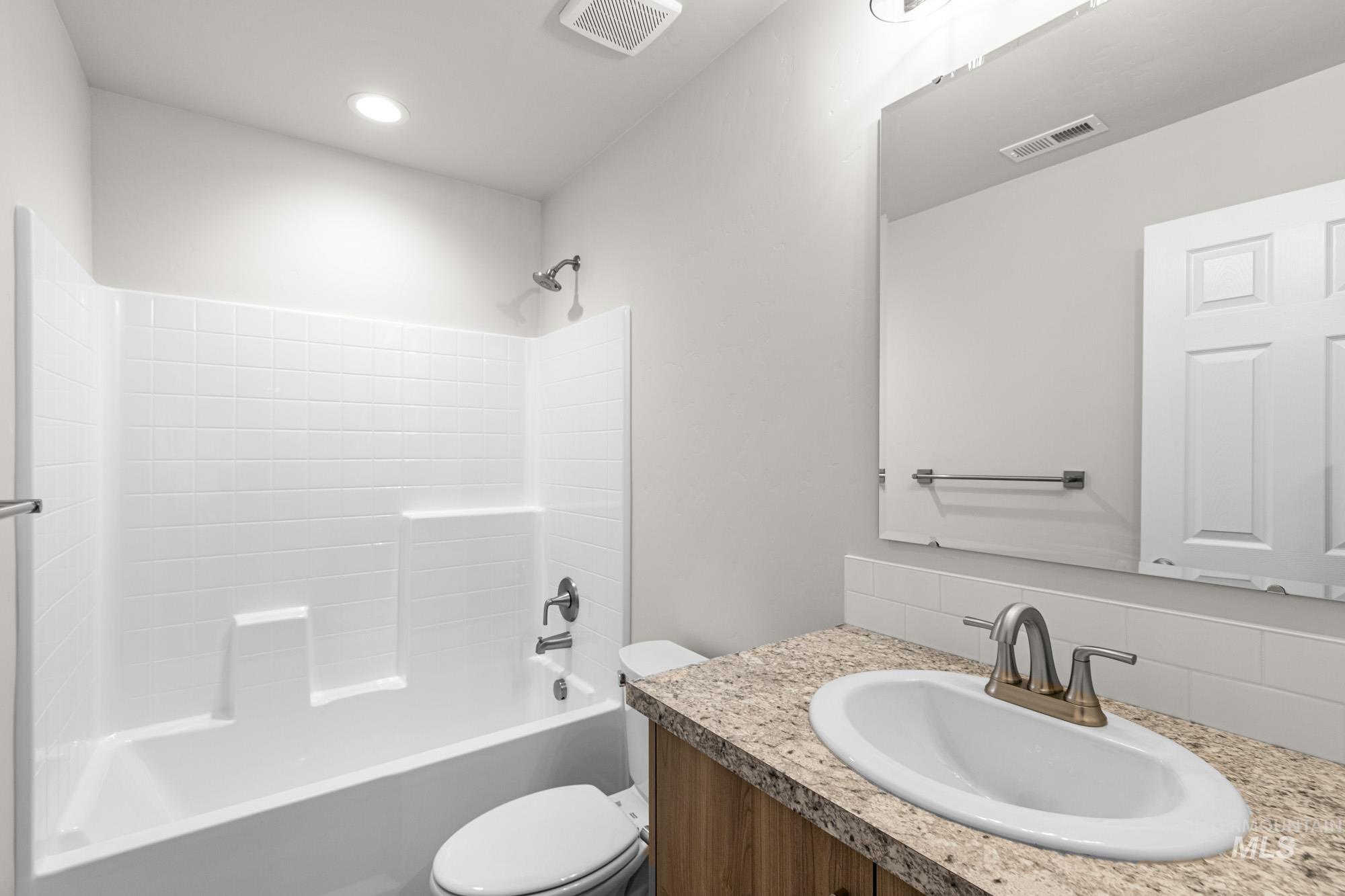 4287 South Red Sox Way Nampa, ID 83686 - Photo 18 of 22 Full bathroom with tub / shower combination, vanity, and tasteful backsplash