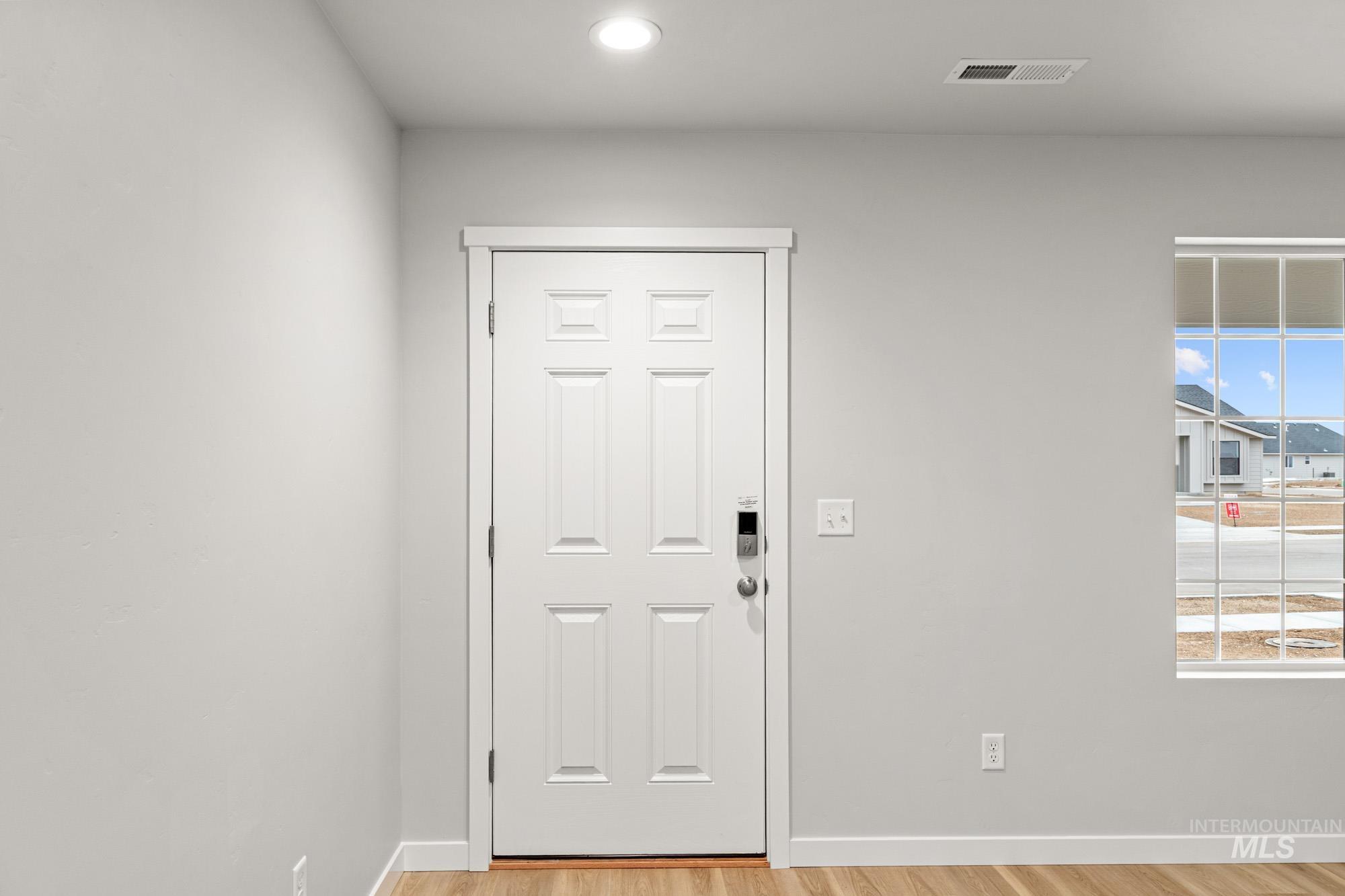 4287 South Red Sox Way Nampa, ID 83686 - Photo 2 of 22 Doorway to outside with wood finished floors and recessed lighting