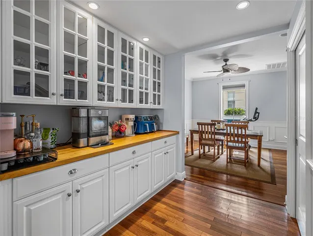 a hallway with a table and chairs