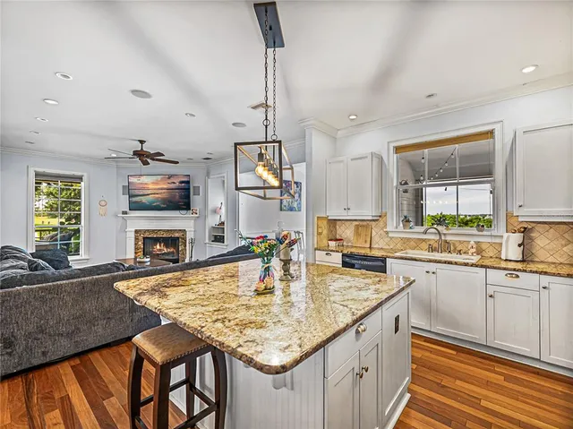 a kitchen with sink cabinets and window