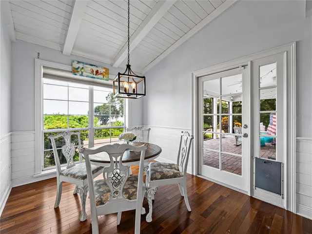 a view of a dining room with furniture window and wooden floor