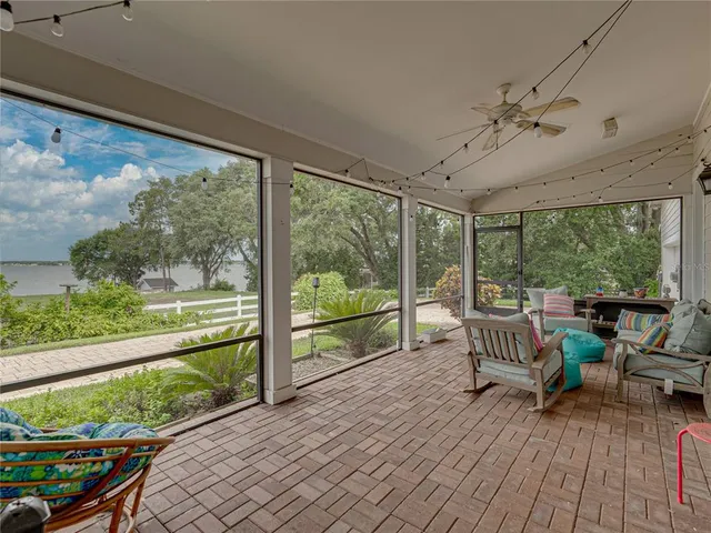 a balcony with furniture and garden view