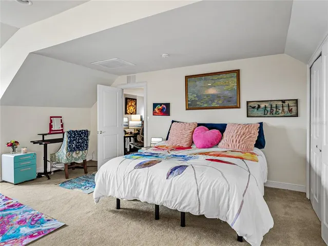 a bedroom with bed and a window