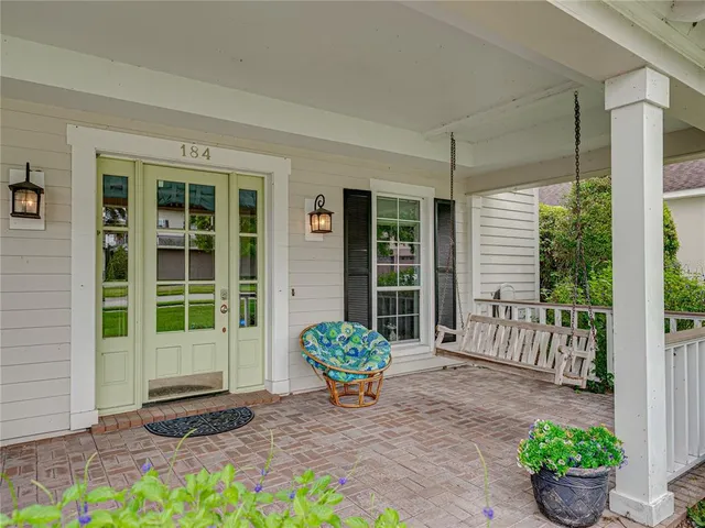 a view of a chair and table in the patio