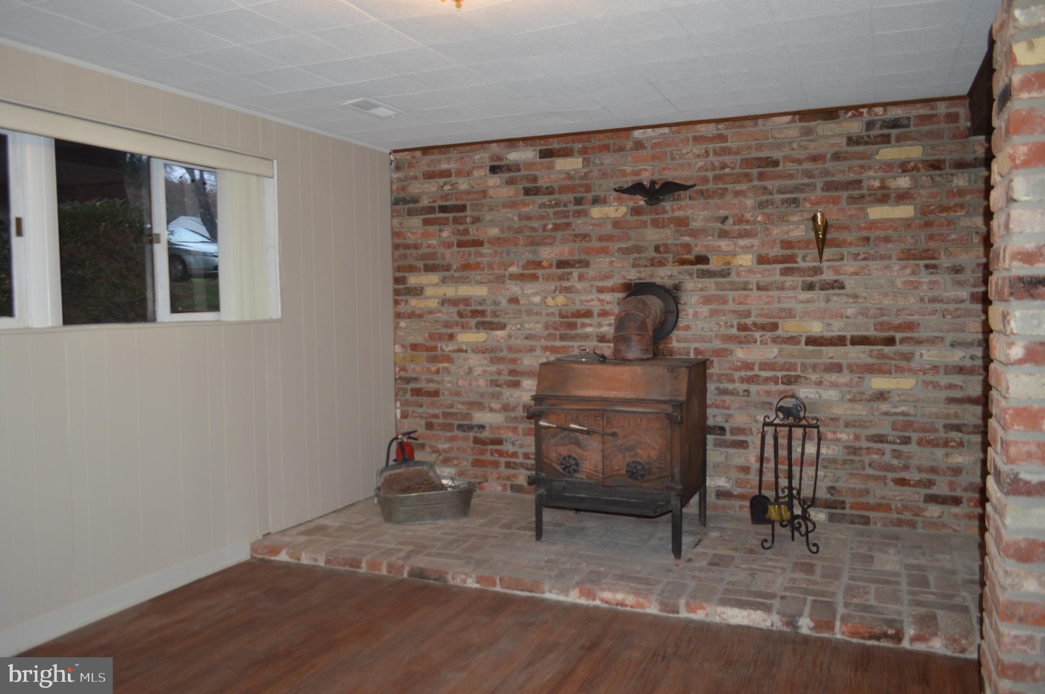 5931 Snowdens Run Road Sykesville, MD 21784 - Photo 23 of 31 Wood burning stove