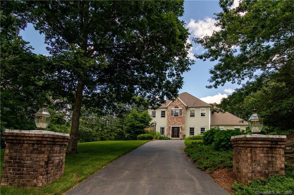 Welcome to 13 Buck Hill Rd, this stately home with a horse shoe driveway and double pillars at each entrance rests on a a very private 1.78 acre lot.