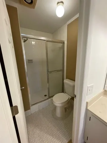 a balcony with table and chairs