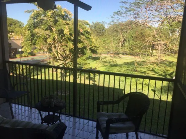 a view of swimming pool with a yard