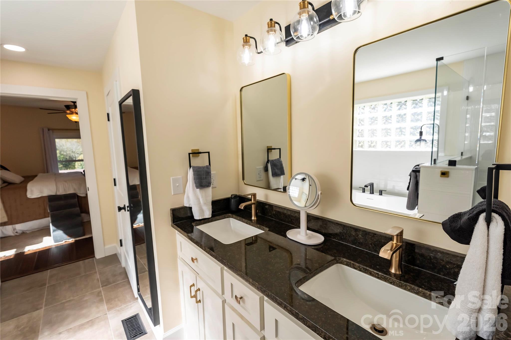 1264 Lilly Drive Clover, SC 29710 - Photo 12 of 37 a bathroom with a double vanity sink and a mirror