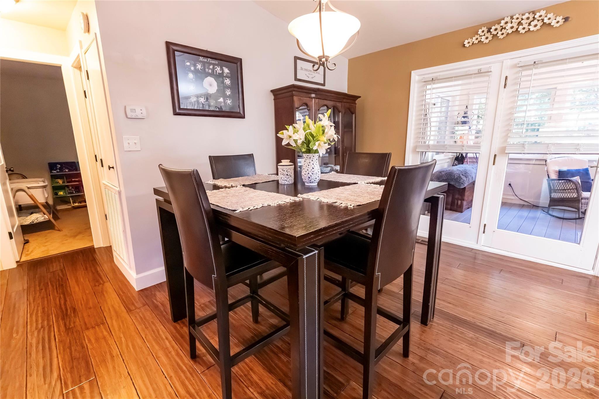 1264 Lilly Drive Clover, SC 29710 - Photo 3 of 37 a view of a dining room with furniture window and wooden floor
