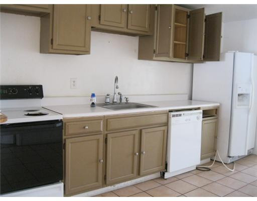 5840 Hope Street Hollywood, FL 33021 - Photo 3 of 3 a kitchen with stainless steel appliances granite countertop a sink stove and refrigerator