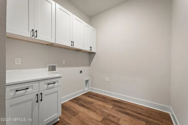 a view of cabinets and wooden floor