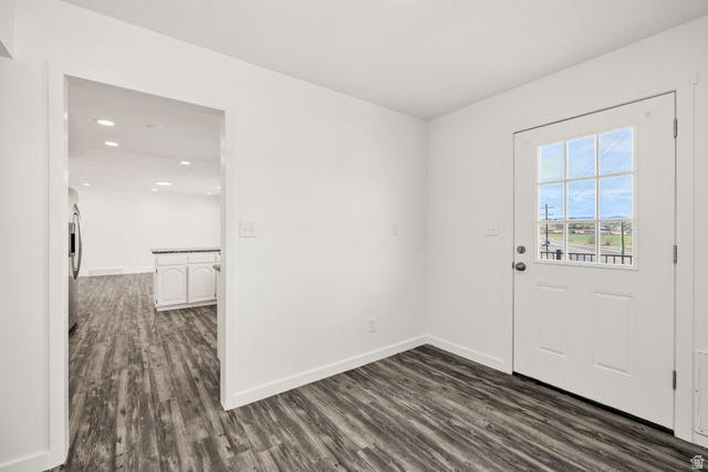 4155 Johnson Road Nibley, UT 84321 - Photo 19 of 71 Interior space next to laundry room featuring wood finished floors and baseboards