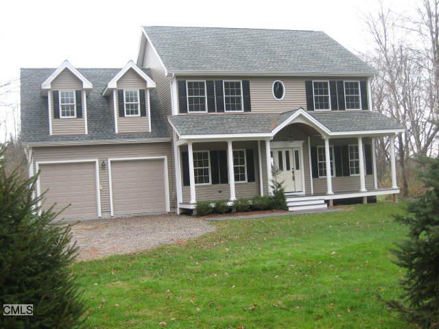 12 Hawleyville Road Bethel, CT 06801 - Photo 1 of 1 a front view of a house with a garden