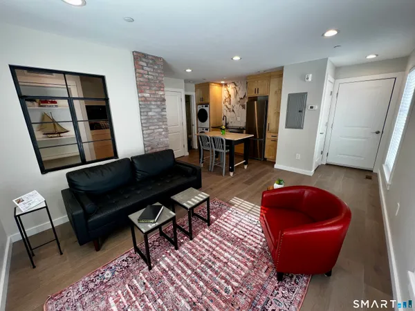a living room with furniture and a rug