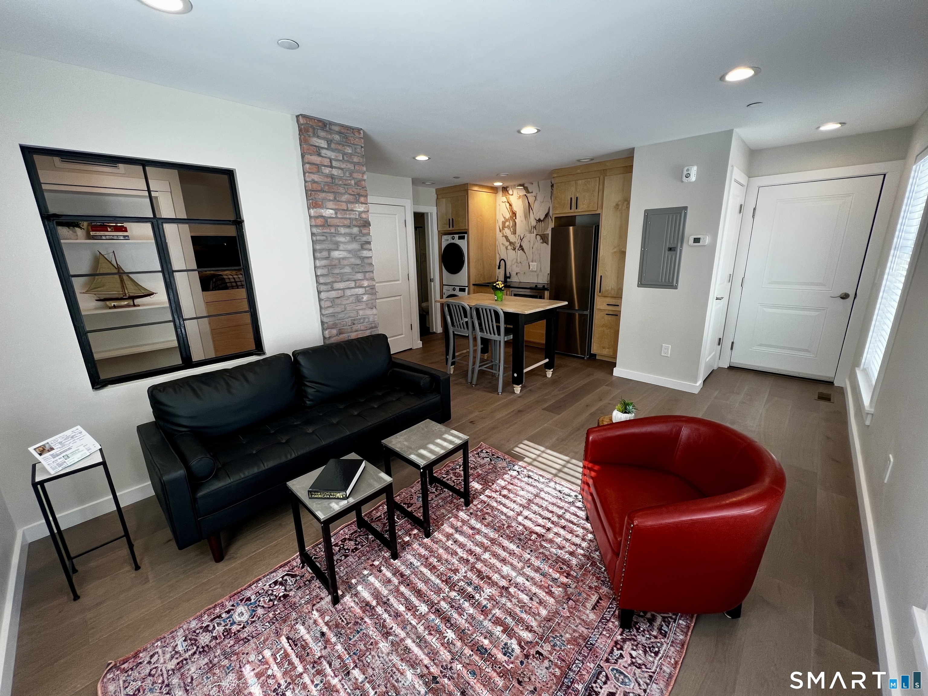 177 Butternut Street, Unit 3 Middletown, CT 06457 - Photo 2 of 23 a living room with furniture and a rug