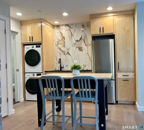 a view of a dining area with furniture window and wooden floor