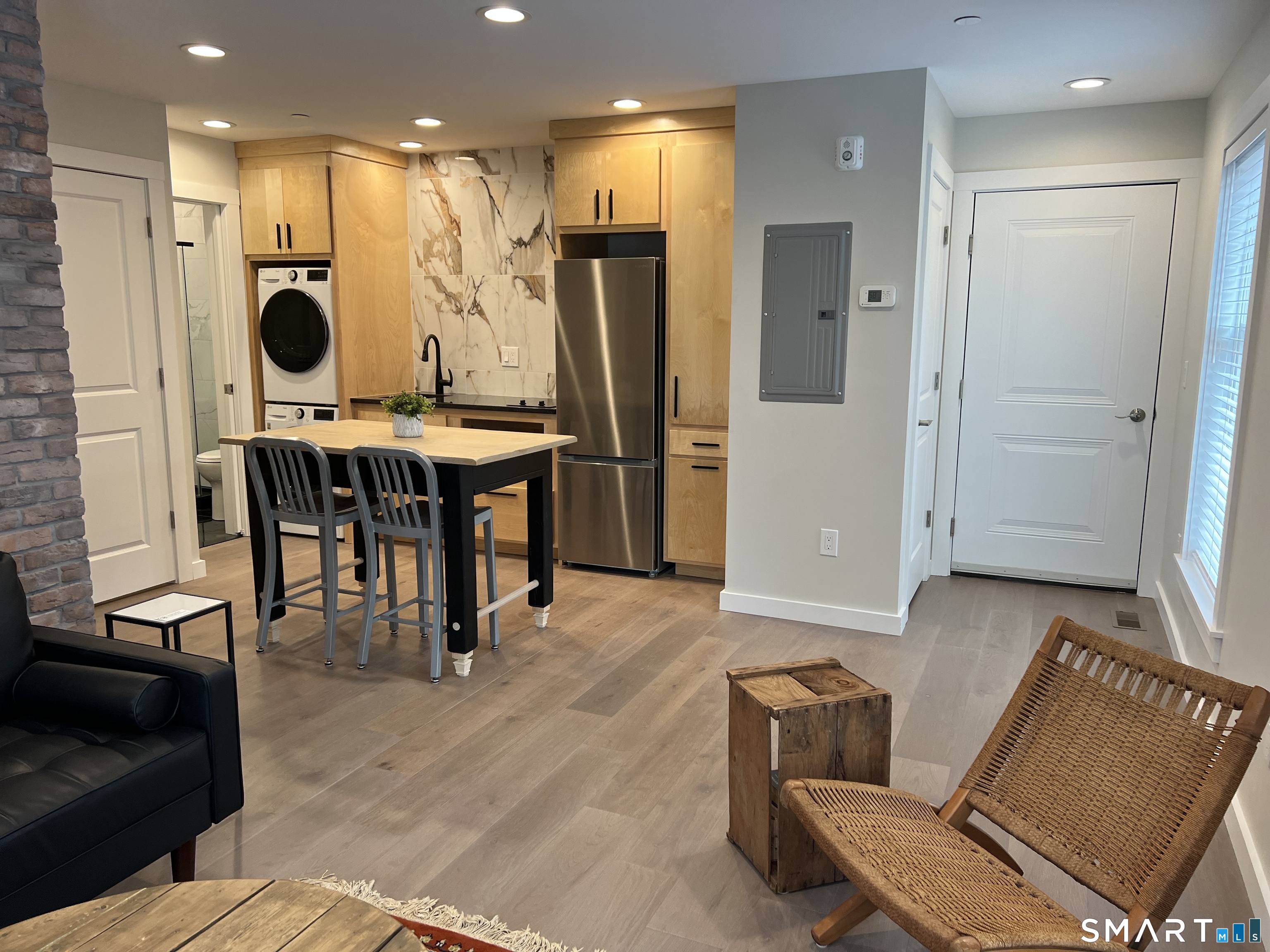 177 Butternut Street, Unit 3 Middletown, CT 06457 - Photo 6 of 23 a living room with furniture and a wooden floor