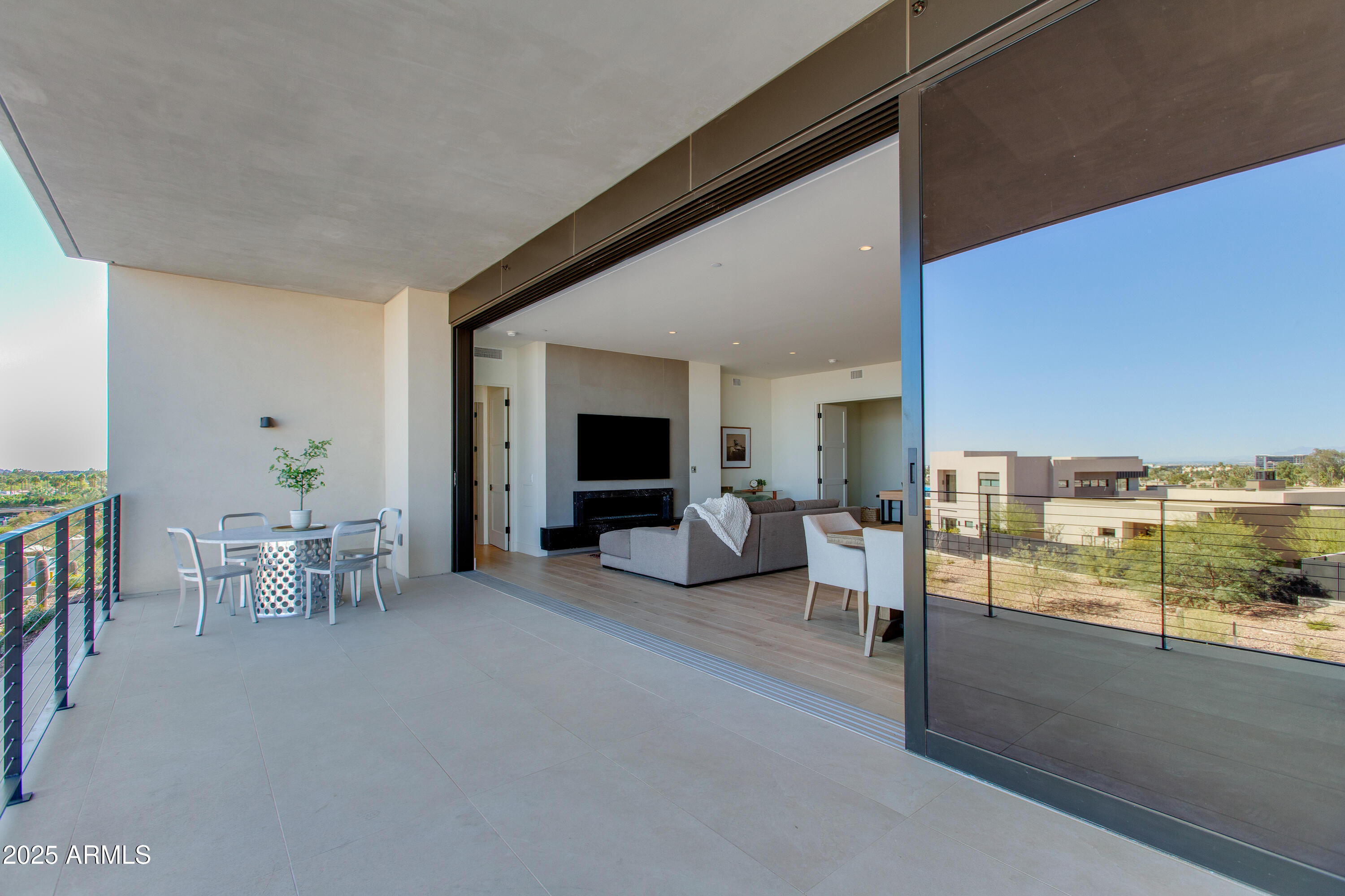 5000 North Camelback Ridge Drive, Unit 206 Scottsdale, AZ 85251 - Photo 39 of 62 a living room with furniture and a large window