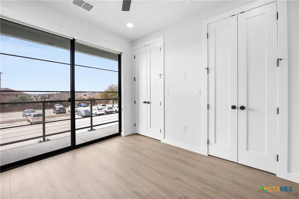 a view of a room with a large window