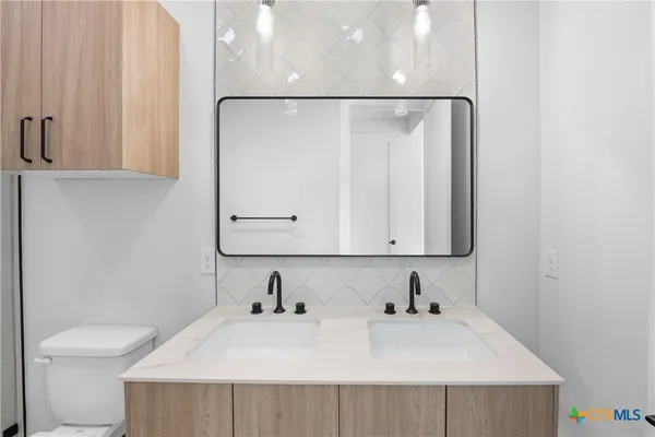 a bathroom with a sink and a toilet