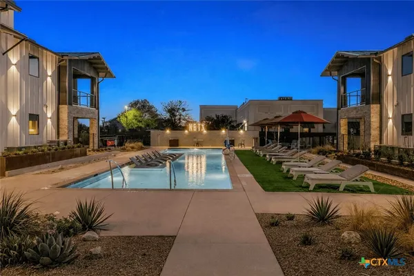 a view of a swimming pool with a patio