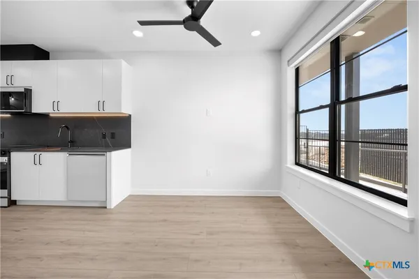 a view of a living room with a large window