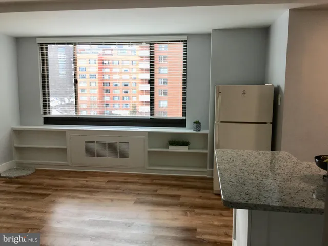a bathroom with a bathtub and a window