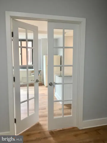 a view of a kitchen from the hallway