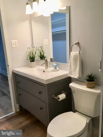 a bathroom with a shower a toilet and a shower