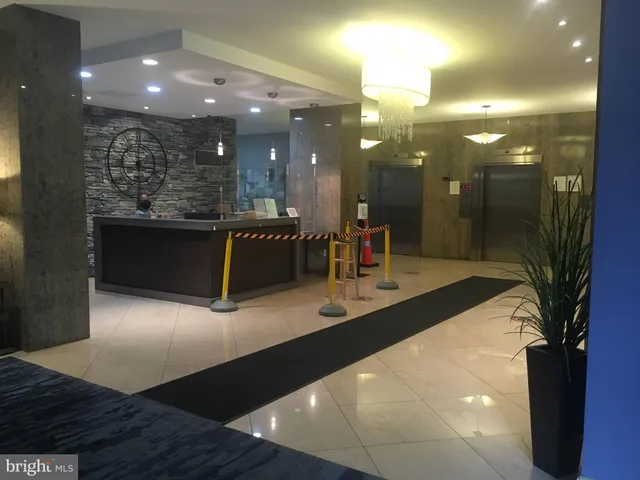 a view of a hallway with a livingroom