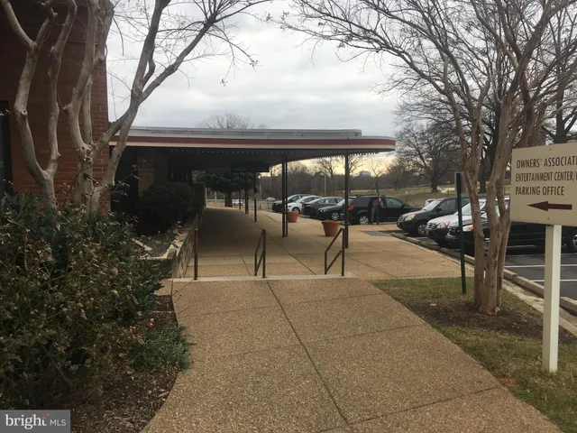 a view of a room with a bench and cabinets