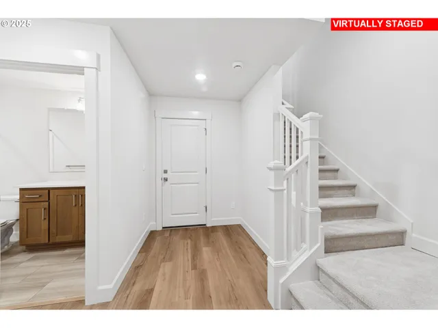 a view of entryway with wooden floor