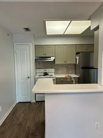 a view of a kitchen with a sink