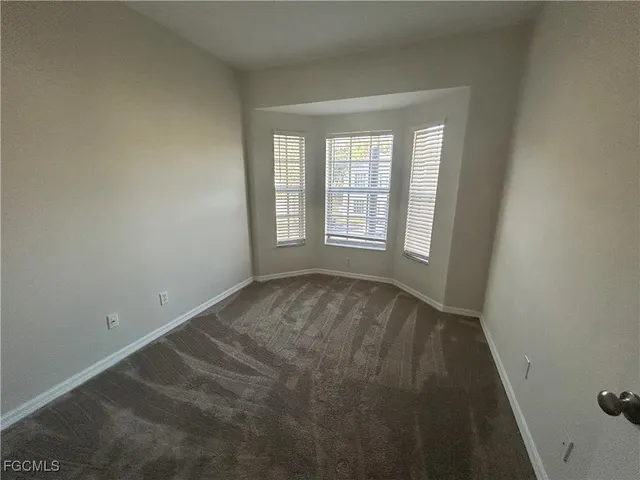 a bathroom with a glass door shower and a sink
