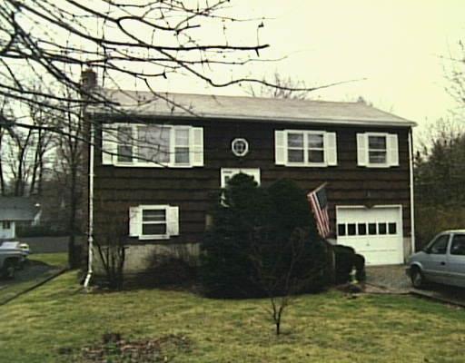 15 Saddle Road Norwalk, CT 06851 - Photo 1 of 1 a front view of a house with a yard