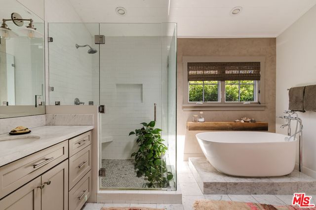 a bedroom with bed and a window