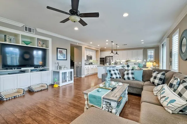 a kitchen with stainless steel appliances granite countertop a sink a stove and cabinets