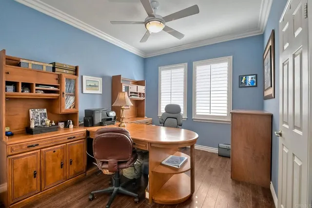 a view of a chairs and table in patio with a fire pit