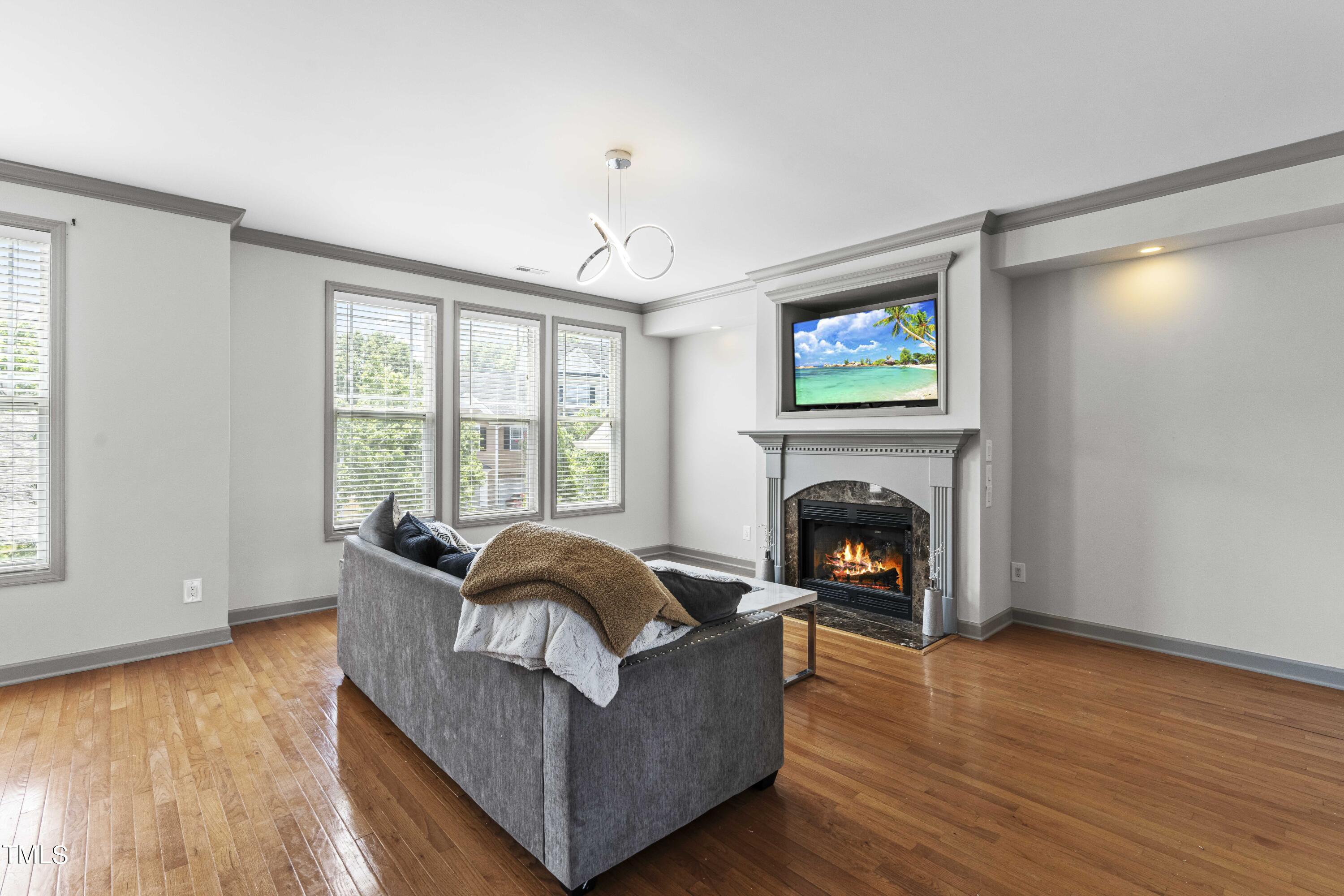 4419 Iyar Way Wake Forest, NC 27587 - Photo 13 of 26 a living room with furniture and a fireplace