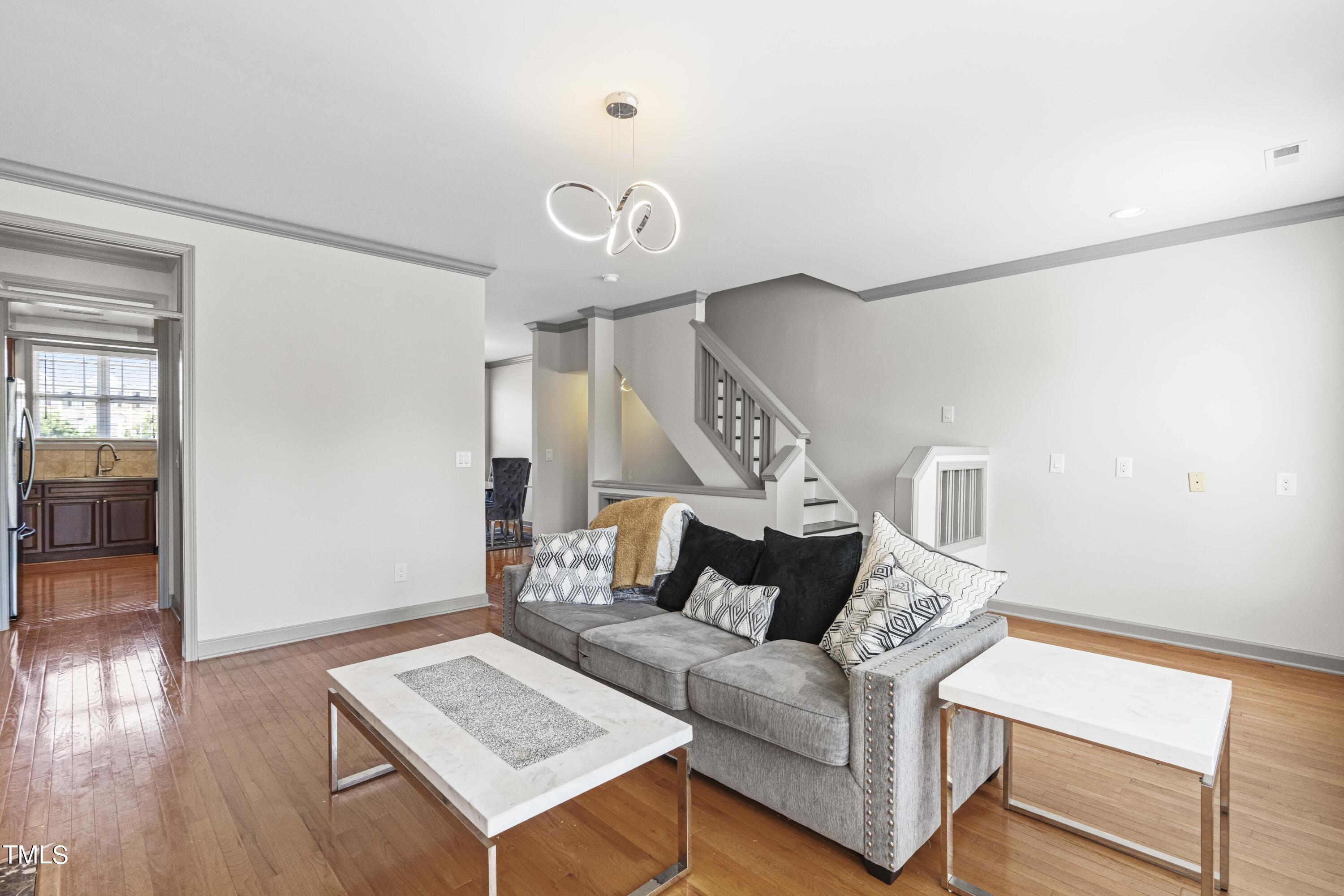 4419 Iyar Way Wake Forest, NC 27587 - Photo 15 of 26 a living room with furniture and wooden floor