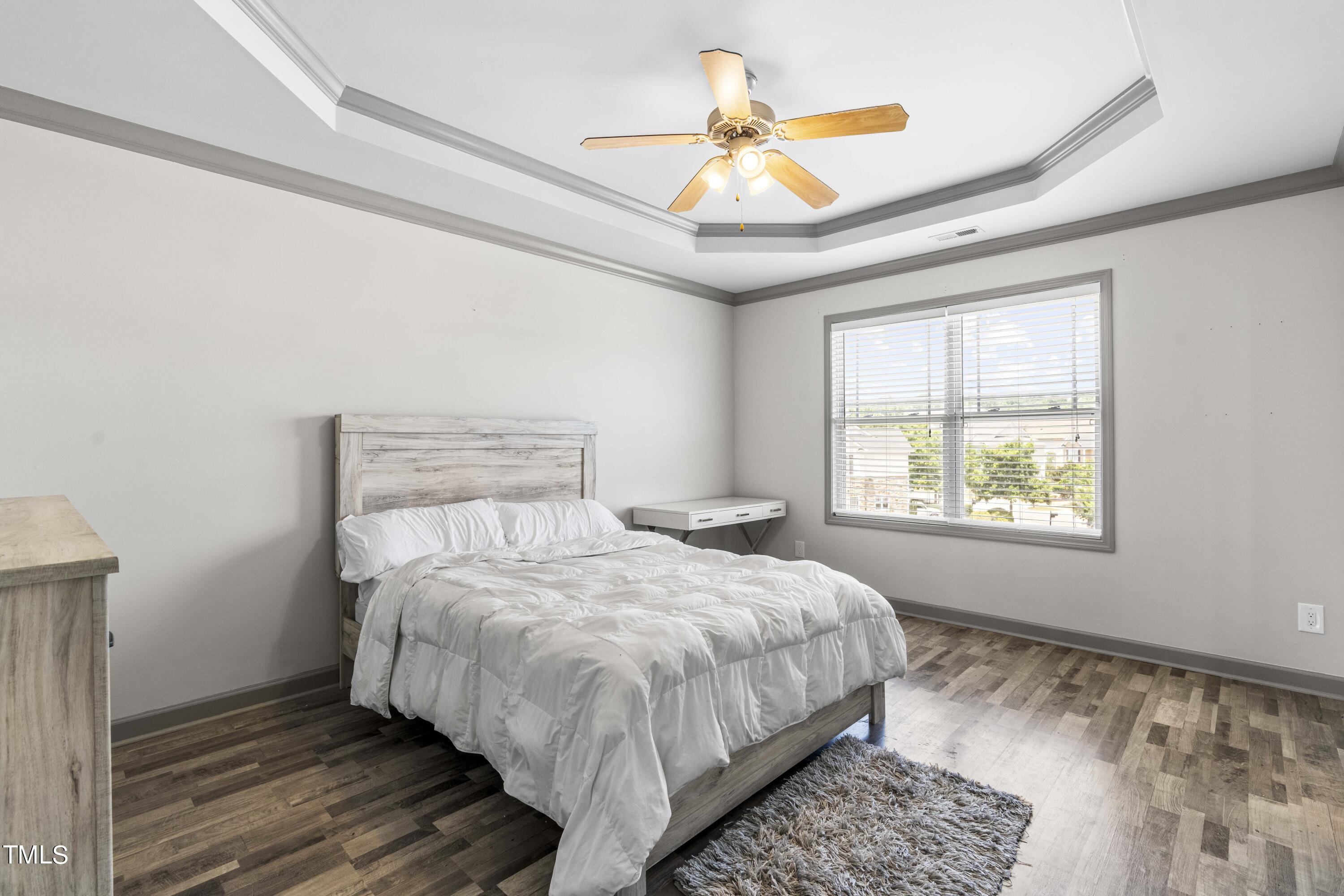 4419 Iyar Way Wake Forest, NC 27587 - Photo 16 of 26 a bedroom with a bed and a large window
