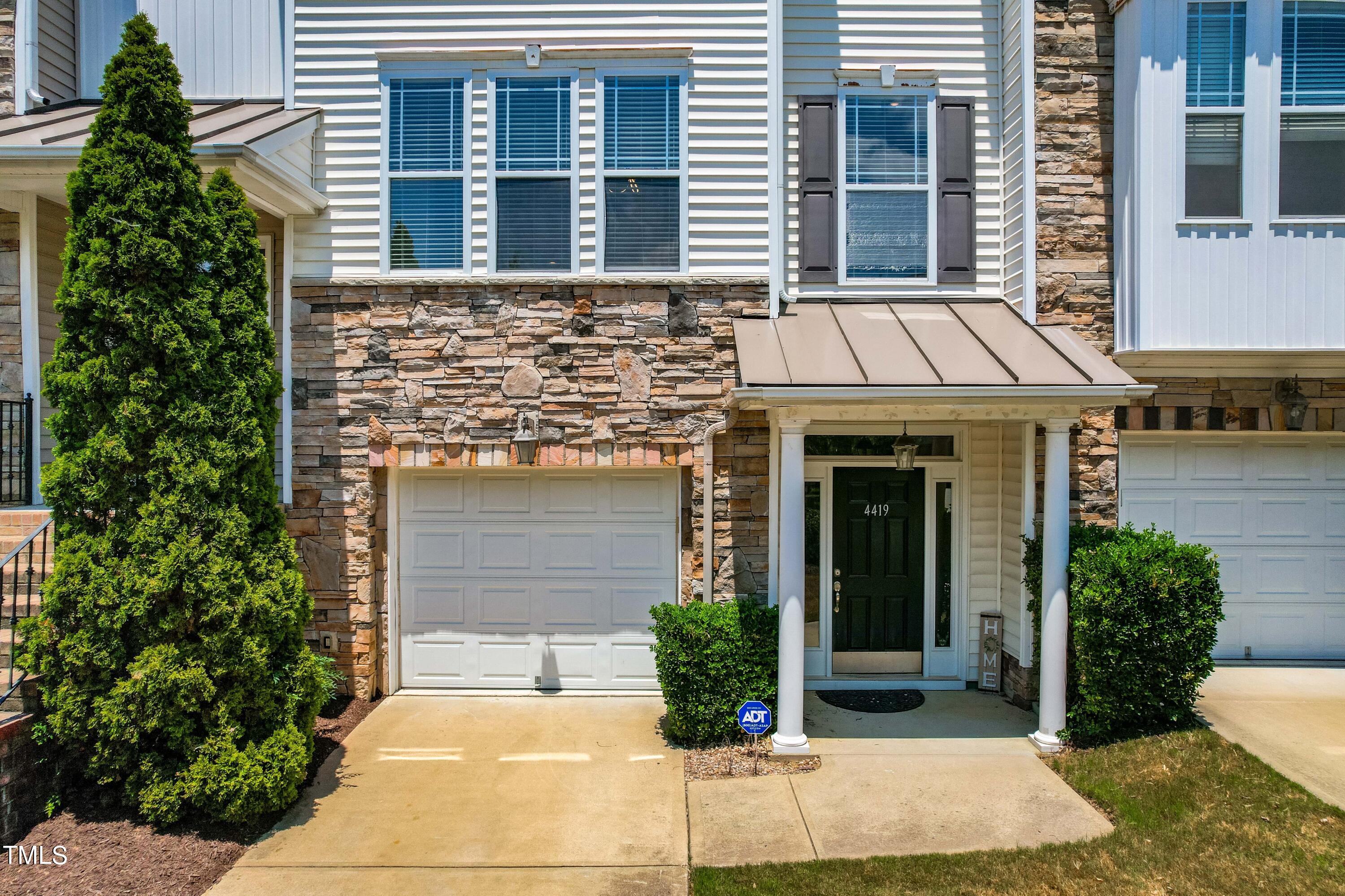 4419 Iyar Way Wake Forest, NC 27587 - Photo 2 of 26 a view of a brick house with plants